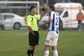 Referee shows the yellow card