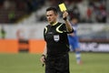 Referee shows the yellow card