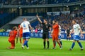 Referee shows a yellow card on the soccer game