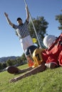 Referee signalling touchdown over football player Royalty Free Stock Photo