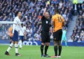 Referee Stuart Attwell shows a yellow card to Willy Boly Royalty Free Stock Photo