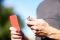 Referee with whistle and red card at soccer game Royalty Free Stock Photo