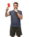 referee whistling whistle and showing red card Royalty Free Stock Photo