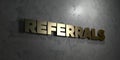 Referrals - Gold text on black background - 3D rendered royalty free stock picture