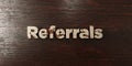 Referrals - grungy wooden headline on Maple - 3D rendered royalty free stock image