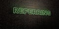 REFERRING -Realistic Neon Sign on Brick Wall background - 3D rendered royalty free stock image
