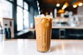 a refillable tumbler filled with iced coffee and a reusable straw