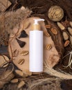 Cosmetic one pump bottle on wood near natural boho decorations top view. Label Mockup