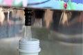 Refilling a plastic water bottle from a vending machine , shallow depth of field Royalty Free Stock Photo