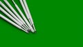 Refills for a ballpoint pen. Plastic refills for ballpoint pens. Copy space. Stack of white ink refills on green Royalty Free Stock Photo