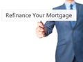 Refinance Your Mortgage - Businessman hand holding sign