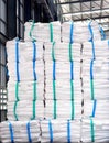 Refine sugar in white jumbo bag stack inside warehouse. Royalty Free Stock Photo