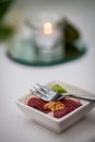 Refined Bite: Gourmet Hors d'Oeuvre with Candlelit Backdrop Royalty Free Stock Photo