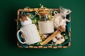 Refined Christmas gift basket for romantic holidays with aroma candle and matches. Royalty Free Stock Photo