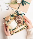 Refined Christmas gift basket for romantic holidays with aroma candle and matches. Royalty Free Stock Photo