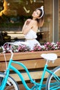 Refined girl on terrace of summer cafe with smile