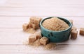 Refined and granulated brown sugar on white table, closeup. Space for text Royalty Free Stock Photo