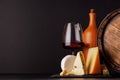 A refined selection of aged cheeses presented on a board, accompanied by a glass of wine Royalty Free Stock Photo