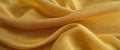 Refined subtle gold-tone fabric in pleats