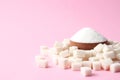 Refined sugar on a colored background. Diabetes concept, excess sugar