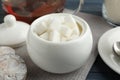 Refined sugar cubes in ceramic bowl on table Royalty Free Stock Photo