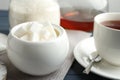 Refined sugar cubes in ceramic bowl on table Royalty Free Stock Photo