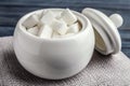 Refined sugar cubes in ceramic bowl on table Royalty Free Stock Photo