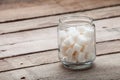 Refined sugar in cubes in glass capacity