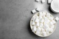 Refined sugar cubes on grey table. Space for text Royalty Free Stock Photo