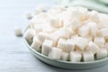 Refined sugar cubes on white wooden table, closeup Royalty Free Stock Photo