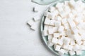 Refined sugar cubes on white wooden table Royalty Free Stock Photo