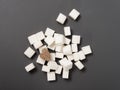Refined sugar lump white and cane on a gray background Royalty Free Stock Photo