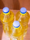 Refined Sunflower oil is light and odorless, poured into plastic bottles with a blue lid. Royalty Free Stock Photo