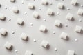 Refined white sugar cubes with stevia pills on grey background Royalty Free Stock Photo