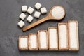 Refined white sugar powder and cubes. Statistical table of sale and consumption Royalty Free Stock Photo