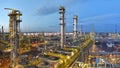 Refinery - chemical factory at night with buildings, pipelines and lighting - industrial plant