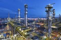 Refinery - chemical factory at night with buildings, pipelines and lighting - industrial plant Royalty Free Stock Photo