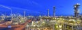 Refinery - chemical factory at night with buildings, pipelines and lighting - industrial plant Royalty Free Stock Photo