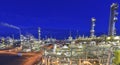 Refinery - chemical factory at night with buildings, pipelines and lighting - industrial plant Royalty Free Stock Photo