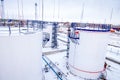 Refinery factory oil storage tanks under cloudy sky Royalty Free Stock Photo