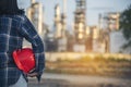 Refinery plant woman worker oil petrochemical industry hand holding red worker hard hat. Woman Emergency workers hands holding Royalty Free Stock Photo