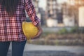 Refinery woman worker oil petro industry hand hold yellow worker helmet hard hat. Woman worker hands holding hardhat yellow work Royalty Free Stock Photo