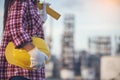 Refinery woman worker oil petro industry hand hold yellow worker helmet hard hat. Woman worker hands holding hardhat yellow work Royalty Free Stock Photo