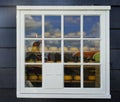 Reflaction of Zaanse Schans Windmills in window