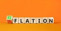 Reflation or inflation symbol. Concept word Reflation Inflation on beautiful wooden cubes. Beautiful orange table orange