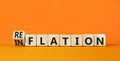 Reflation or inflation symbol. Concept word Reflation Inflation on beautiful wooden cubes. Beautiful orange table orange