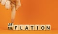 Reflation or inflation symbol. Concept word Reflation Inflation on beautiful wooden cubes. Beautiful orange table orange