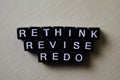 Reflect - Rethink - Redo on wooden blocks. Business and inspiration concept