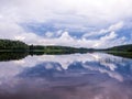 Reflected forest and clouds in lake Royalty Free Stock Photo