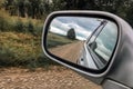 Reflected in the mirror on the side of the road cars, travel in Russia